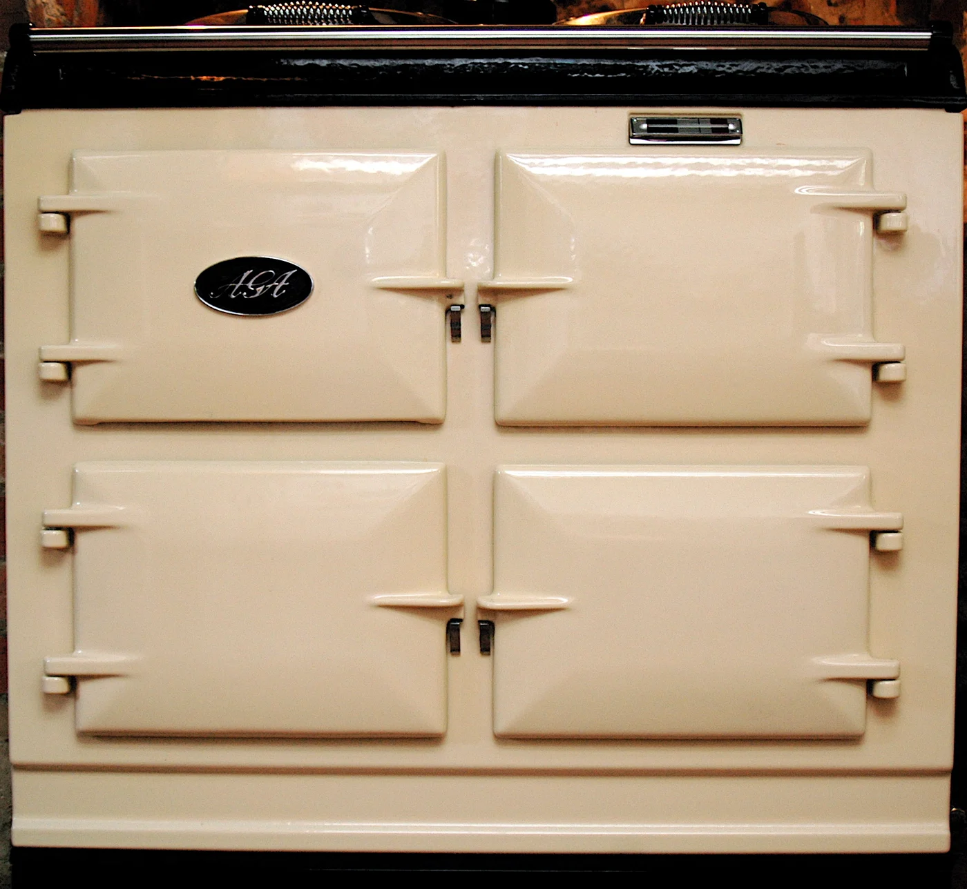 Cream AGA cooker with doors and covered hotplates