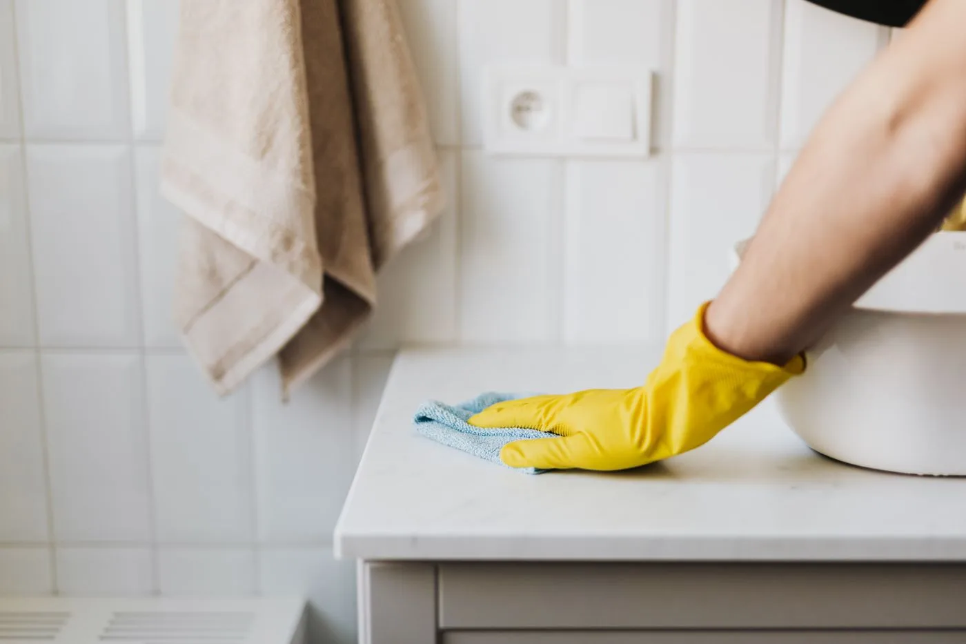 Wiping a bathroom cabinet